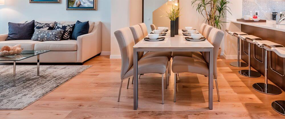 Brown wood floor in open dining room